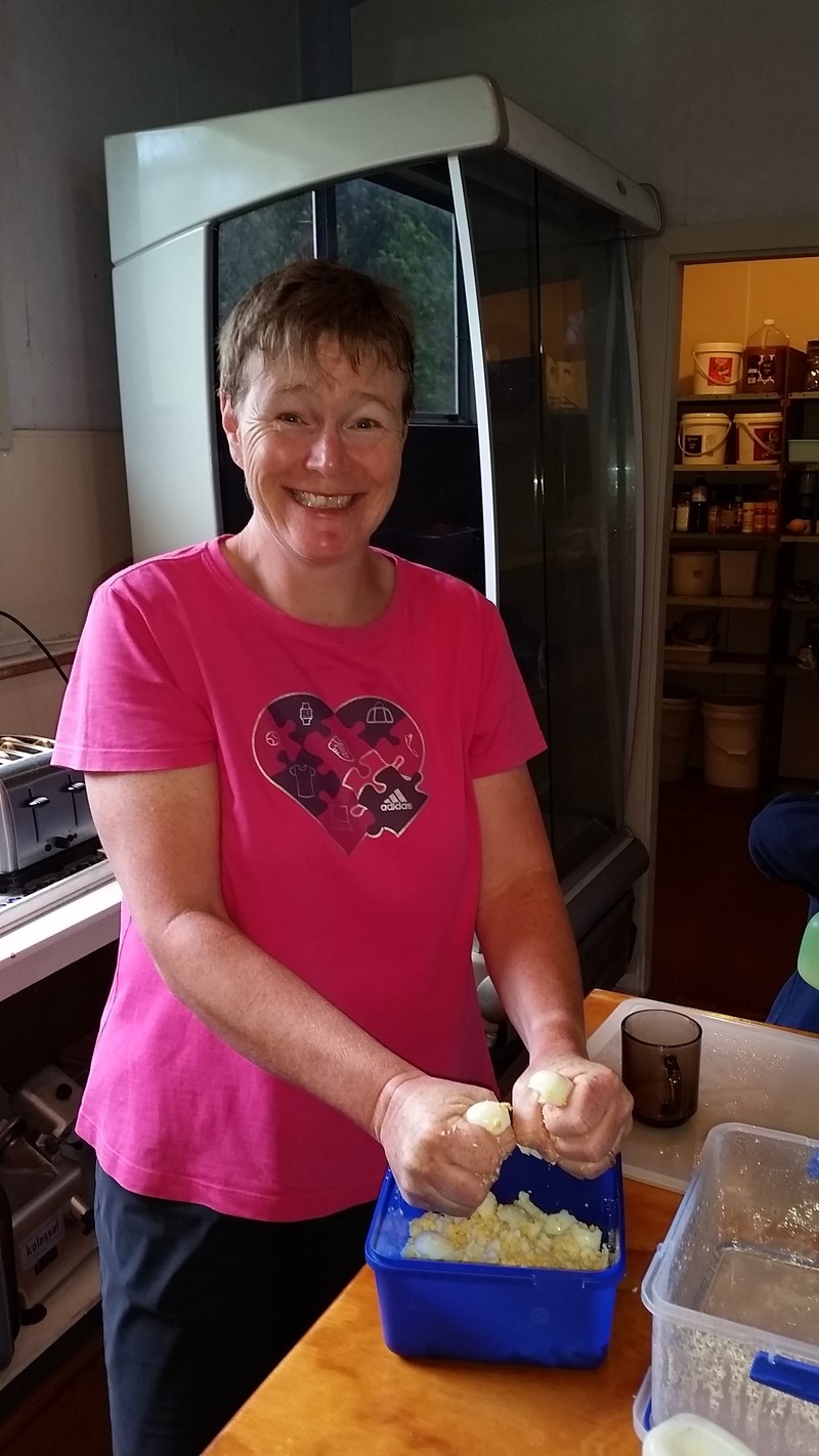 A trusted helper smashing eggs for lunch